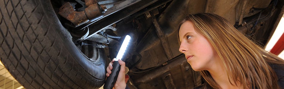 Motor Vehicle student looking at a tyre